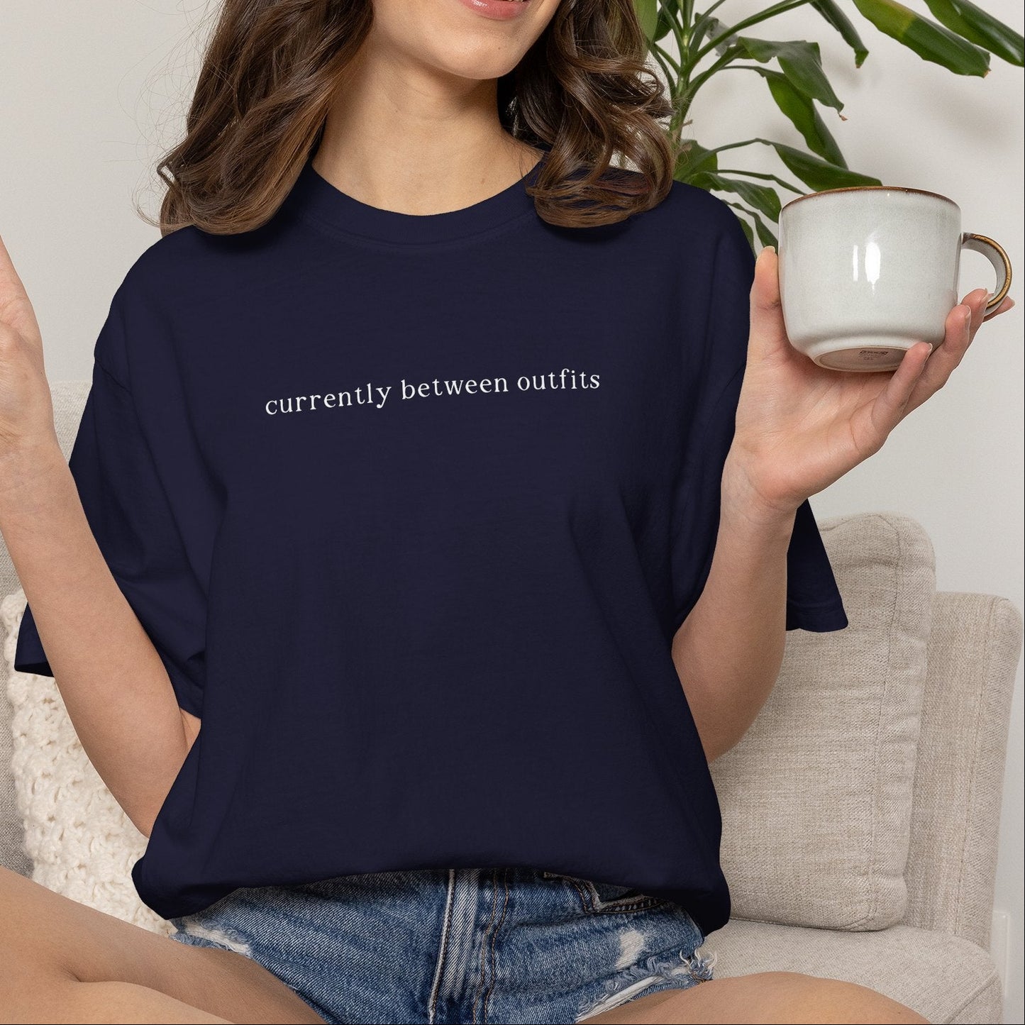 "Currently Between Outfits" T-Shirt